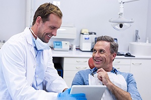 Man smiling with dental implants 