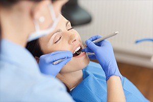 Relaxed woman receiving dental care