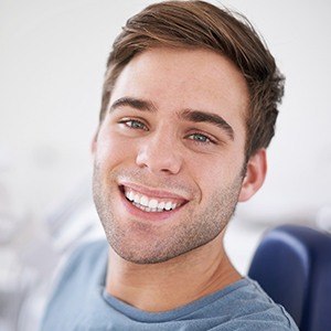 Smiling man in dental chair