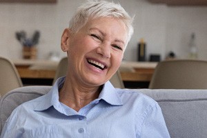 A happy and healthy older woman laughing