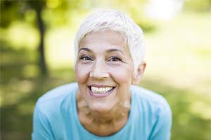 Older woman pleased with dentures in Lakewood