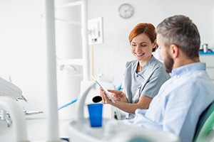 Denture dentist in Lakewood talking to patient