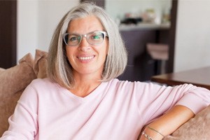 Woman smiling with dental implants in Dallas  