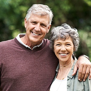 Smiling senior man and woman outdoors