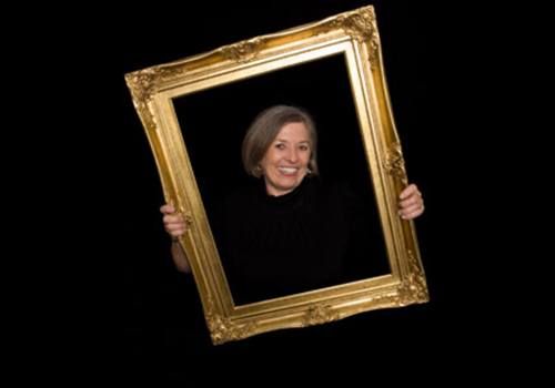 Actual patient, Cindy, posing with picture frame around her