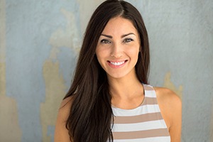 Woman smiles after receiving veneers in Dallas