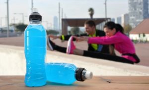 people stretching with sports drinks 