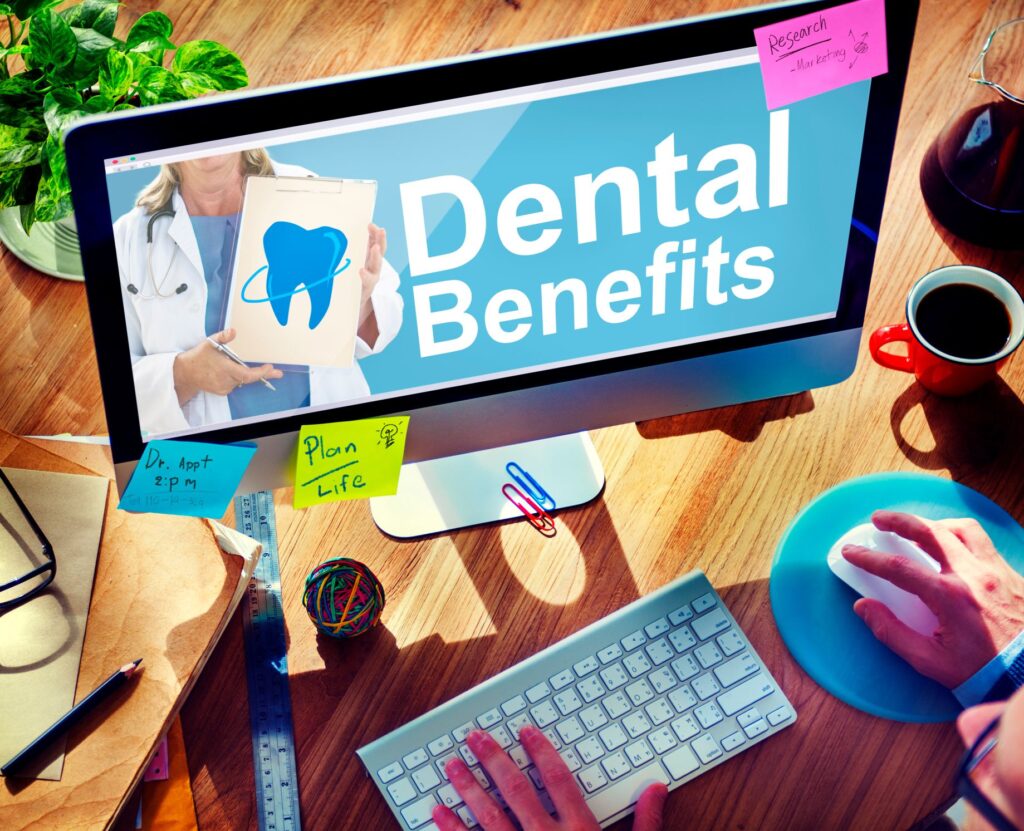 Dental benefits on a computer screen with sticky notes
