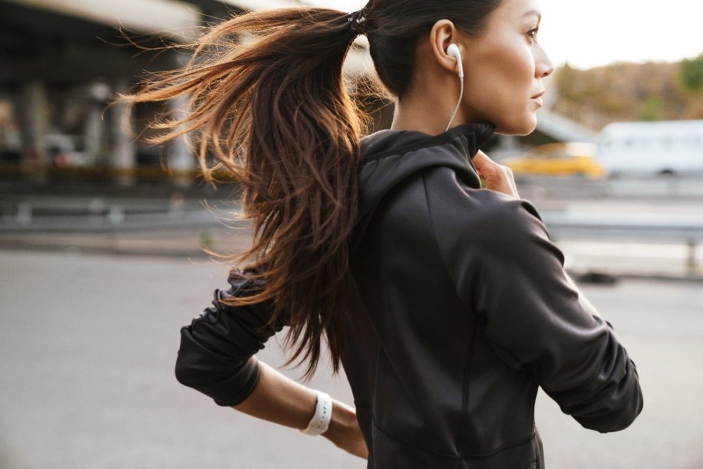 Closeup of woman running outside