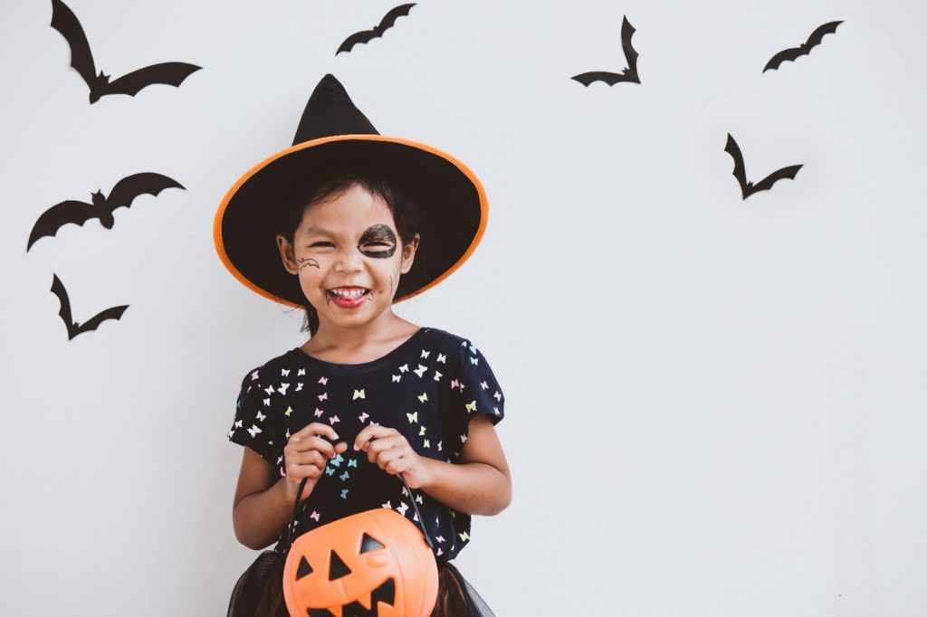 Young girl smiling in her Halloween costume