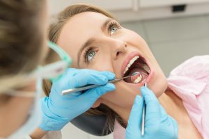 woman getting teeth cleaned