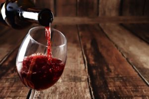 Red wine being poured into a glass